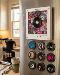 MagnetVinyl frame with the full set of nine magnetic photo discs on a fridge